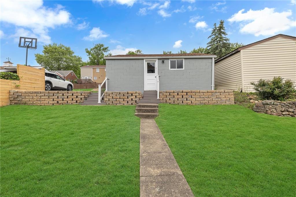 1160 6th Street Beaver, PA 15009 - Photo 25 of 31 a front view of a house with a garden