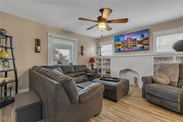a living room with furniture and a fireplace
