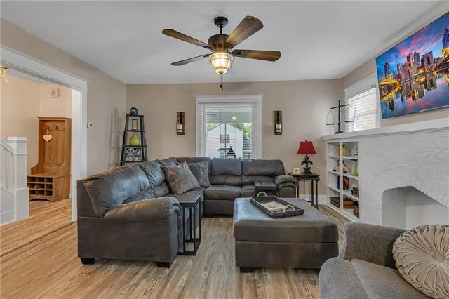 a living room with furniture and a fireplace