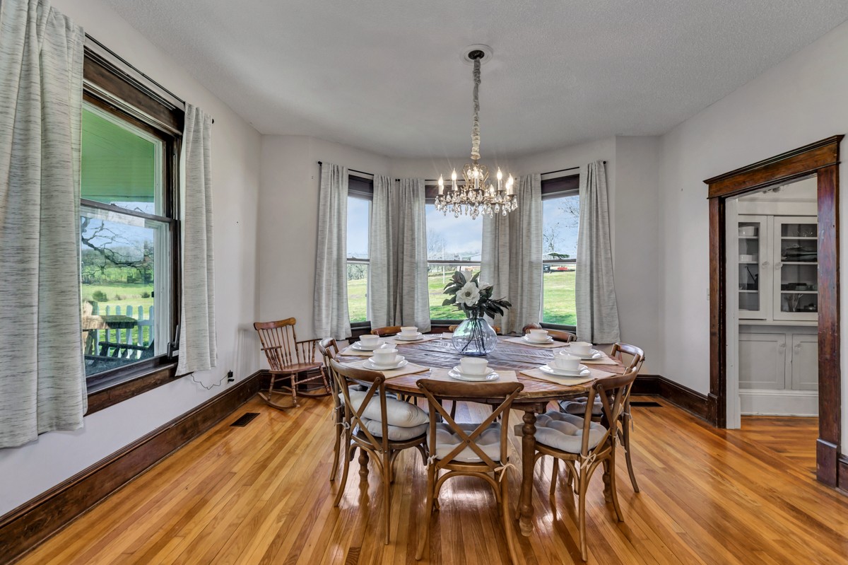 451 Wheelerton Road Dellrose, TN 38453 - Photo 12 of 34 a view of a dining room with furniture window and wooden floor