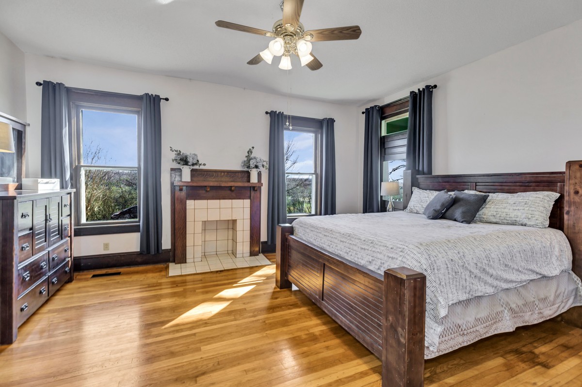 451 Wheelerton Road Dellrose, TN 38453 - Photo 14 of 34 a bed sitting in a spacious bedroom next to a window