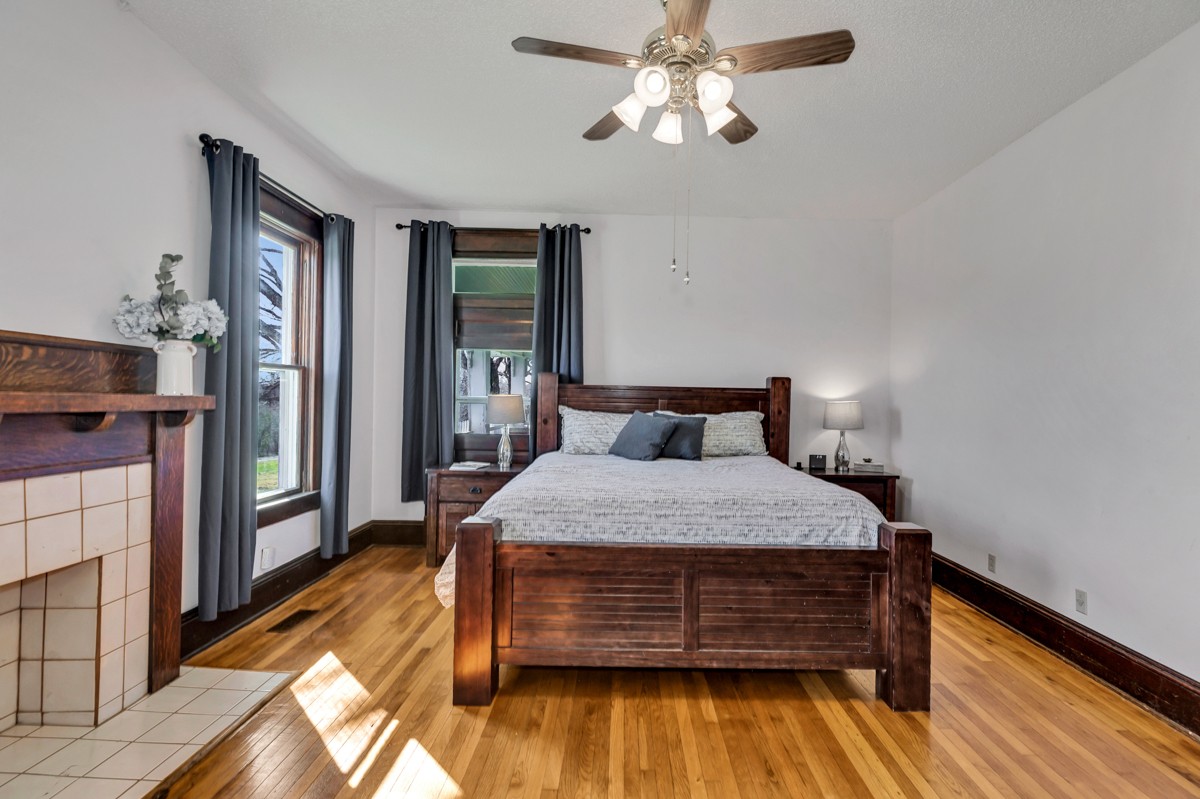 451 Wheelerton Road Dellrose, TN 38453 - Photo 15 of 34 a bedroom with a bed and wooden floor