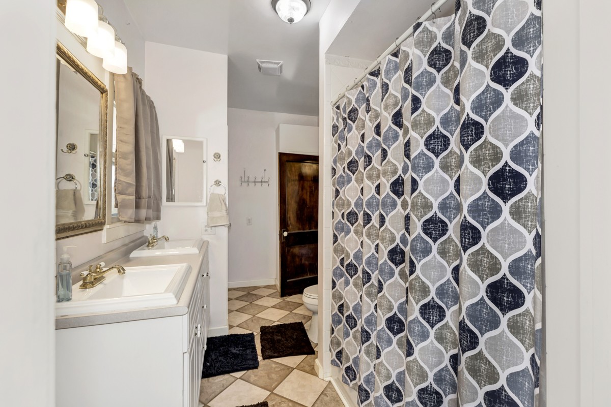 451 Wheelerton Road Dellrose, TN 38453 - Photo 17 of 34 a bathroom with a sink and a mirror