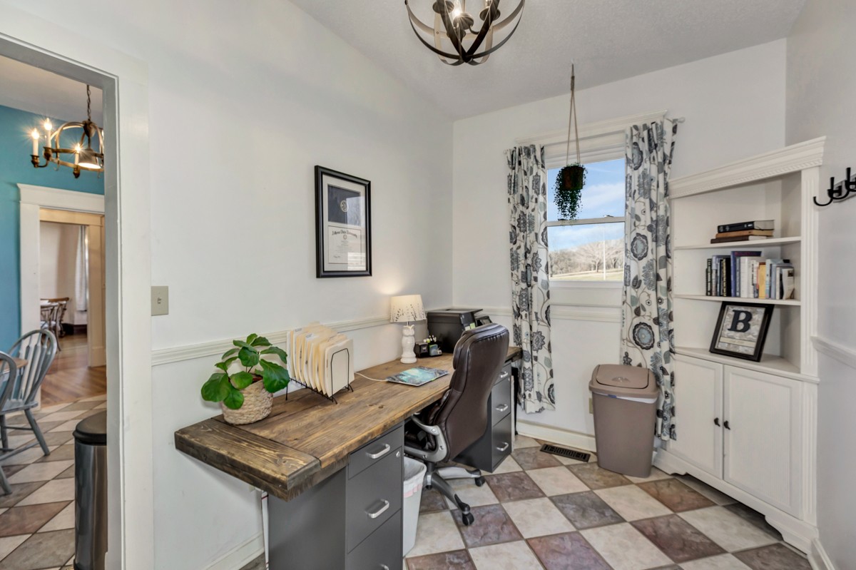 451 Wheelerton Road Dellrose, TN 38453 - Photo 18 of 34 a view of a workspace with furniture and a potted plant