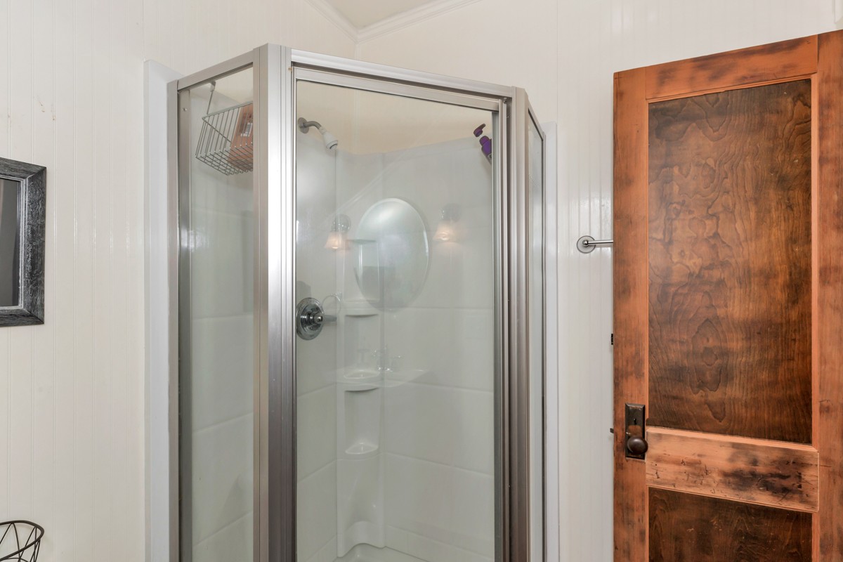 451 Wheelerton Road Dellrose, TN 38453 - Photo 23 of 34 a bathroom with a glass shower door