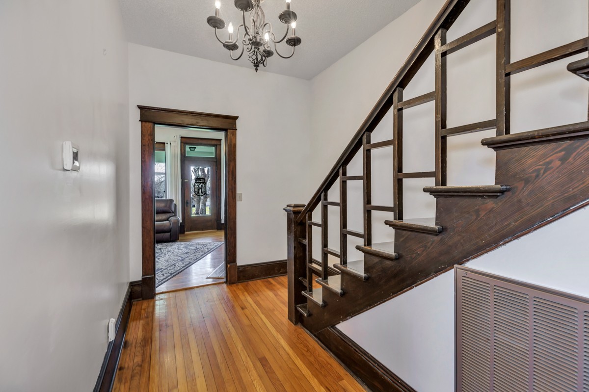 451 Wheelerton Road Dellrose, TN 38453 - Photo 5 of 34 a view of a hallway with wooden floor and staircase