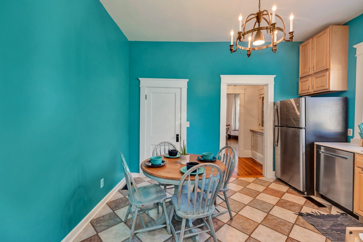451 Wheelerton Road Dellrose, TN 38453 - Photo 10 of 34 a view of a dining room with furniture a chandelier and kitchen view