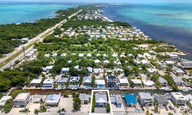 a view of house with backyard and garden
