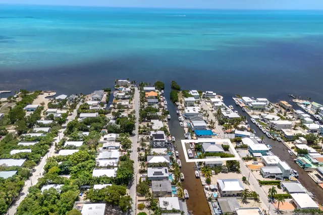a view of a patio with swimming pool table and chairs