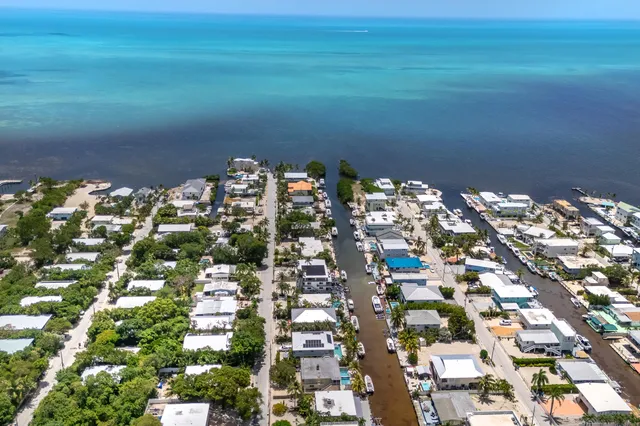 a view of swimming pool with an outdoor seating area and garden view
