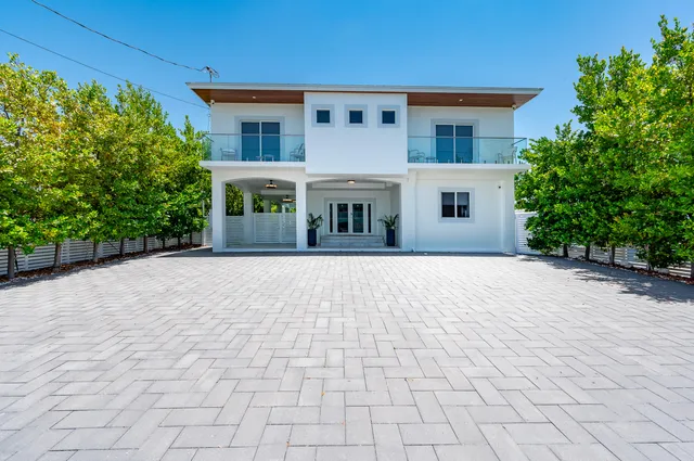 a view of swimming pool with outdoor seating and yard in back