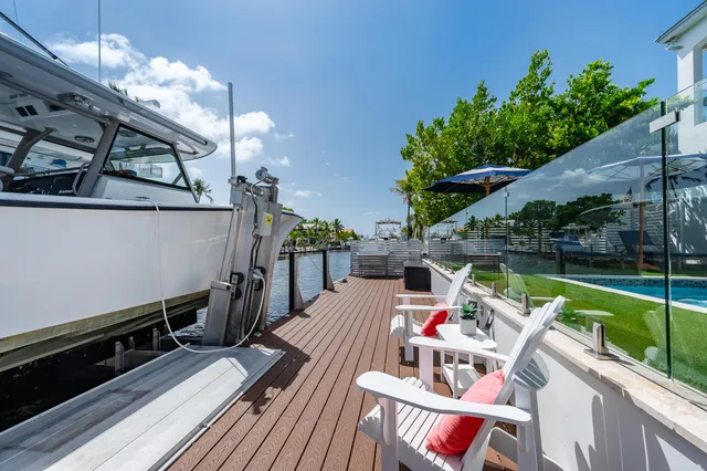 a view of swimming pool with outdoor seating and yard