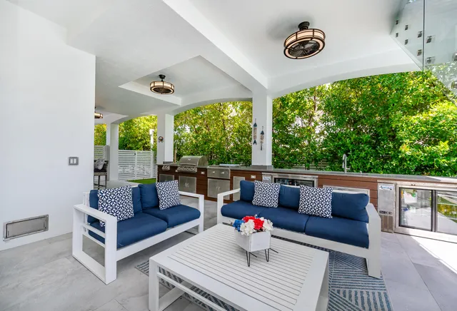 a kitchen with granite countertop cabinets stainless steel appliances and a sink