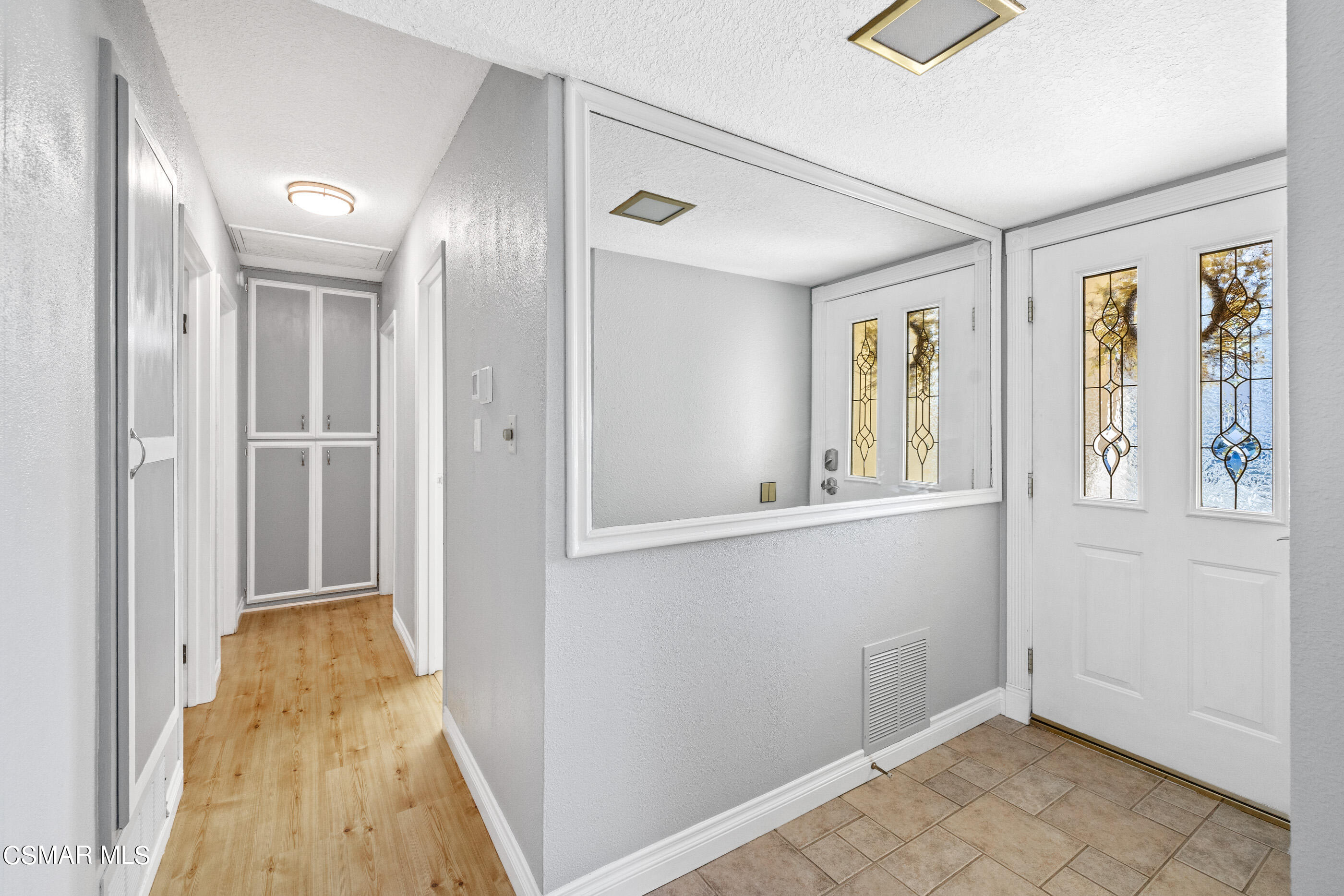 3283 Austin Avenue Simi Valley, CA 93063 - Photo 15 of 30 a view of a hallway with wooden floor and windows