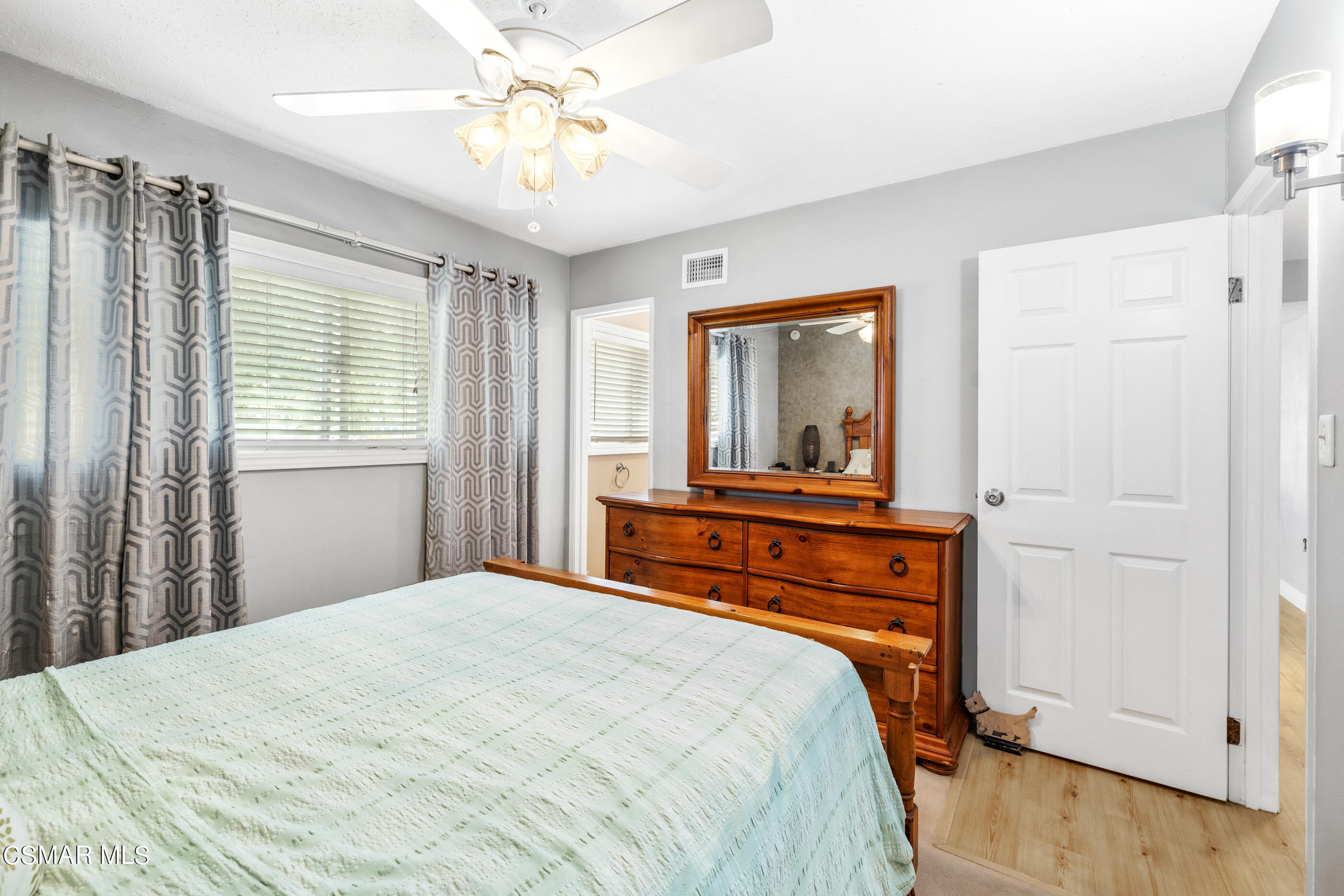 3283 Austin Avenue Simi Valley, CA 93063 - Photo 20 of 30 a bedroom with a bed and a mirror on the dresser