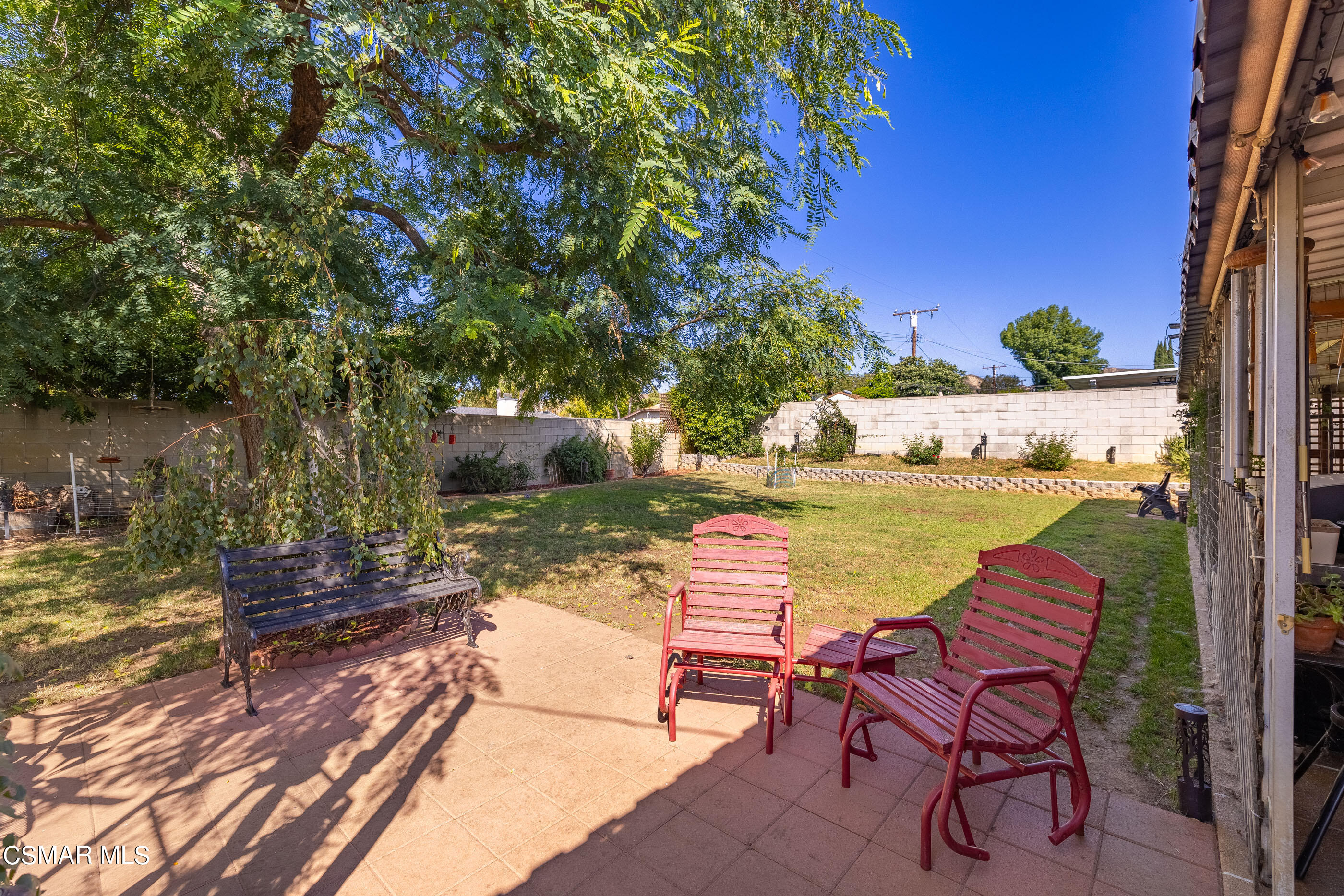 3283 Austin Avenue Simi Valley, CA 93063 - Photo 22 of 30 a view of a lake with table and chairs under an umbrella