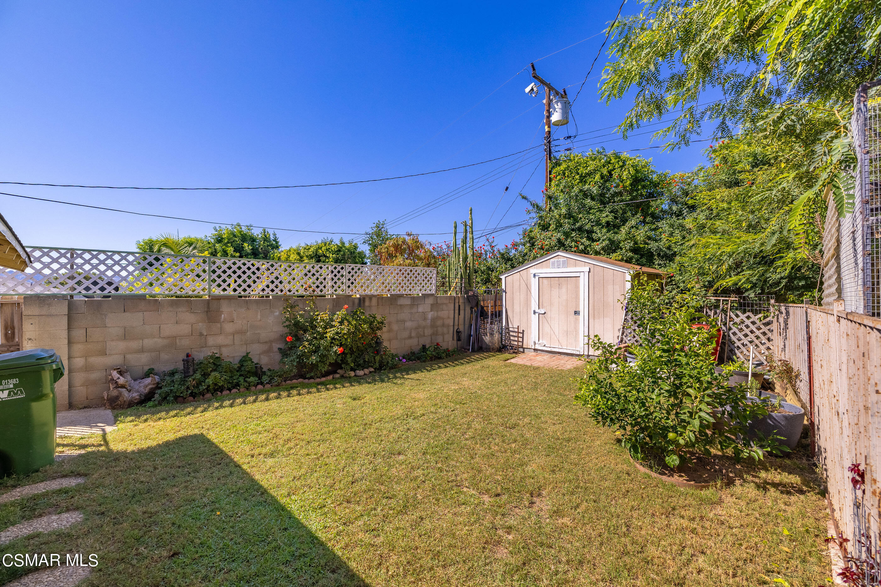 3283 Austin Avenue Simi Valley, CA 93063 - Photo 28 of 30 a front view of a house with a yard and garage