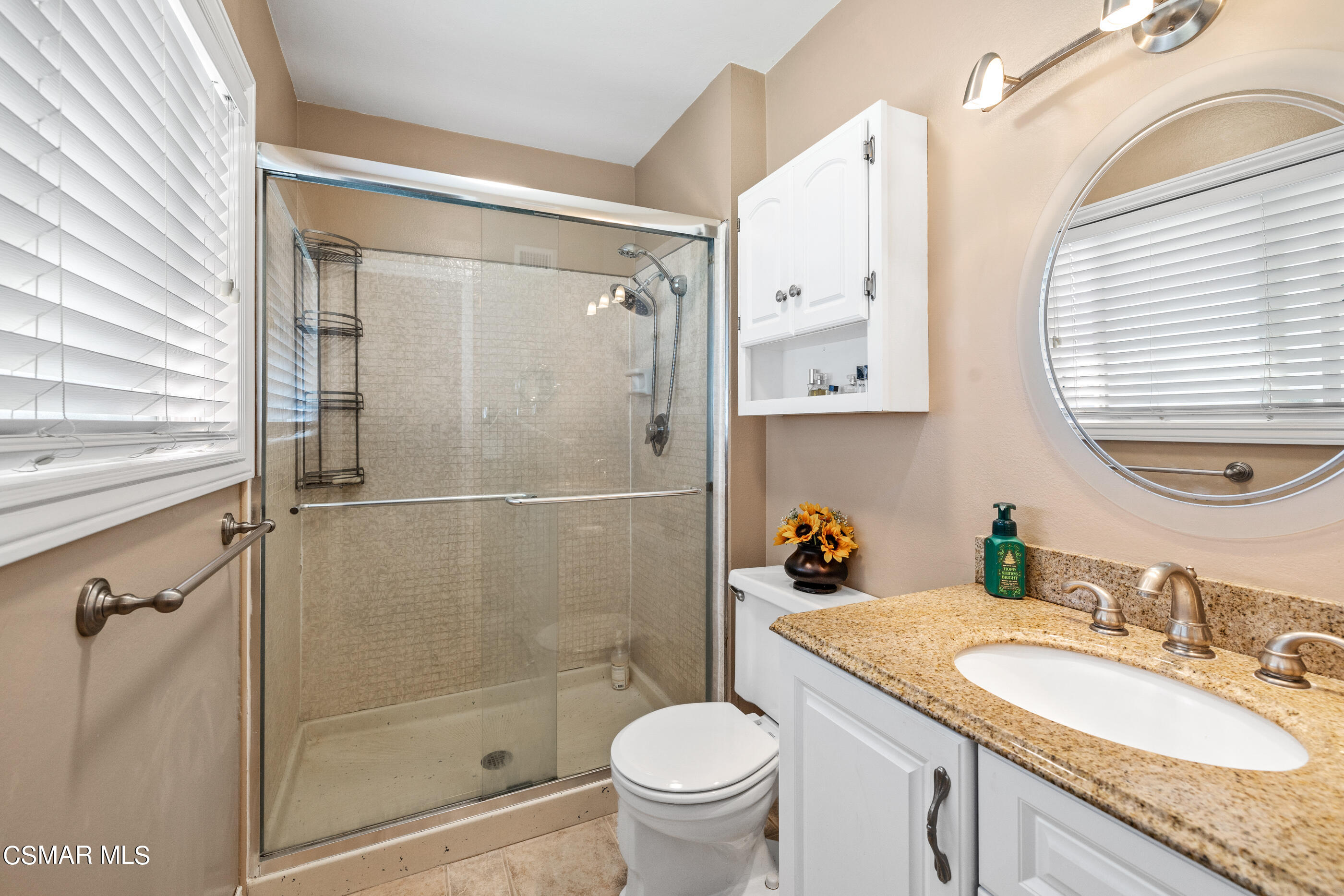 3283 Austin Avenue Simi Valley, CA 93063 - Photo 5 of 30 a bathroom with a granite countertop sink toilet and shower