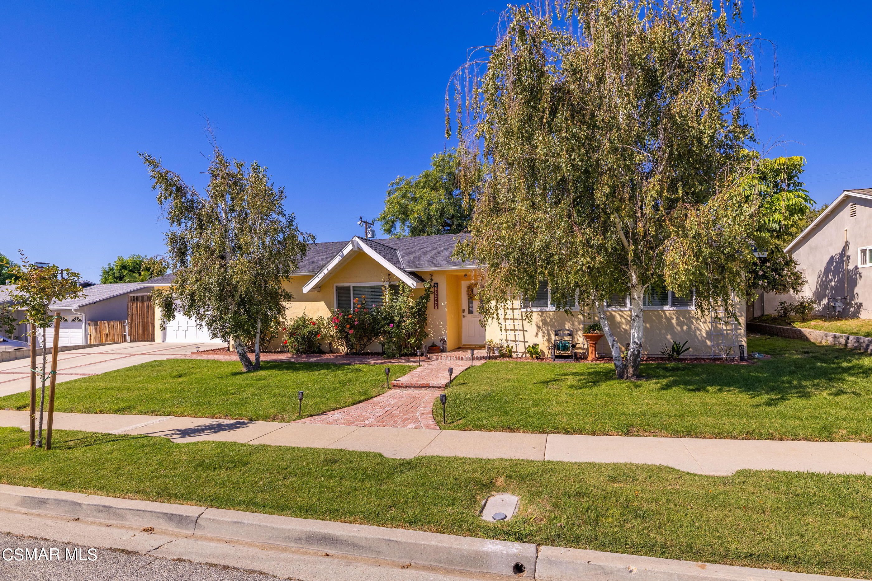 3283 Austin Avenue Simi Valley, CA 93063 - Photo 7 of 30 a front view of a house with a yard