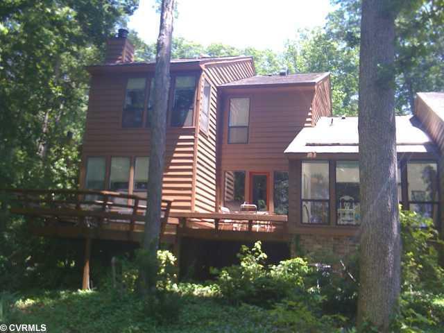 13516 Heathbrook Road Midlothian, VA 23112 - Photo 2 of 12 Exterior Back - Incredible Townhome nestled in trees overlooking golf course and swiftcreek resevoir views! won't last long!
