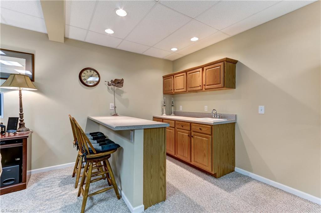 8183 Gray Leigh Court Oak Ridge, NC 27310 - Photo 22 of 29 Basement wet bar area.