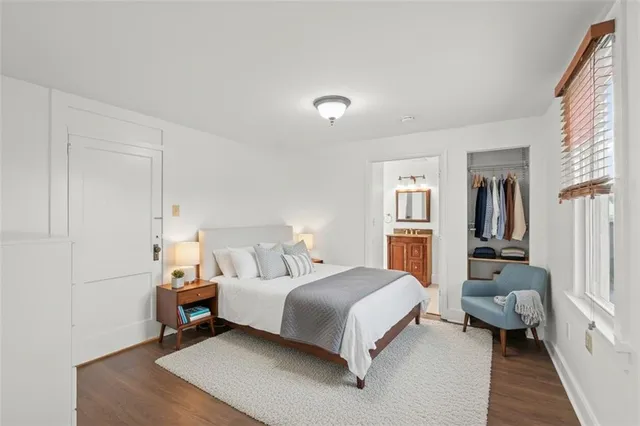 a bedroom with a bed and a couch