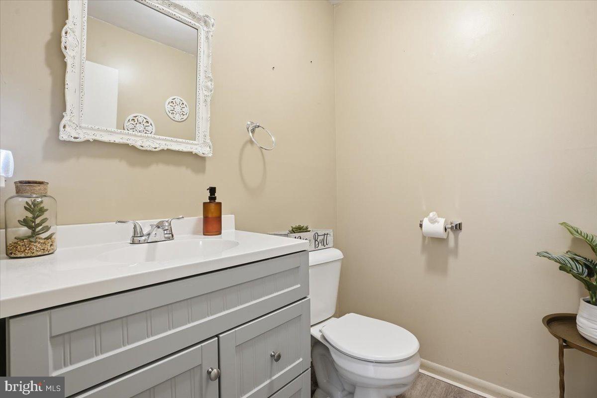 702 Village Road Orwigsburg, PA 17961 - Photo 11 of 27 a bathroom with a sink a toilet and a mirror