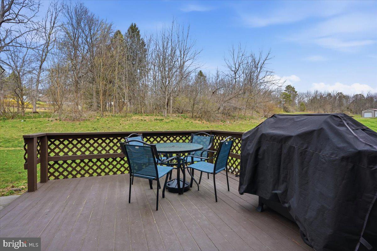 702 Village Road Orwigsburg, PA 17961 - Photo 19 of 27 a view of a chairs and table on the wooden floor