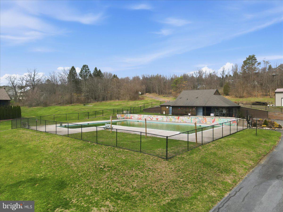 702 Village Road Orwigsburg, PA 17961 - Photo 23 of 27 a view of a lake with a yard