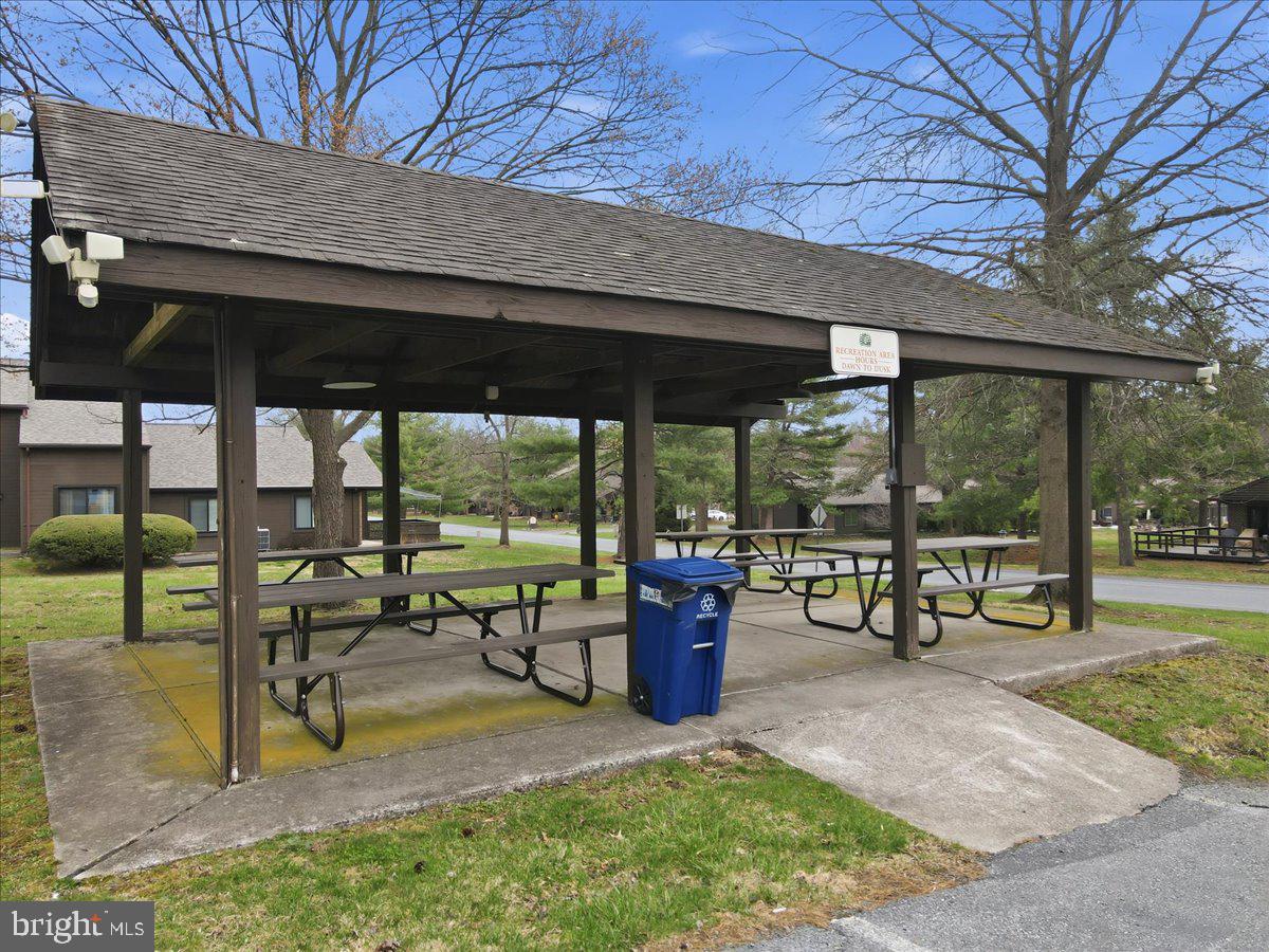 702 Village Road Orwigsburg, PA 17961 - Photo 25 of 27 a view of a patio with a table chairs and a backyard