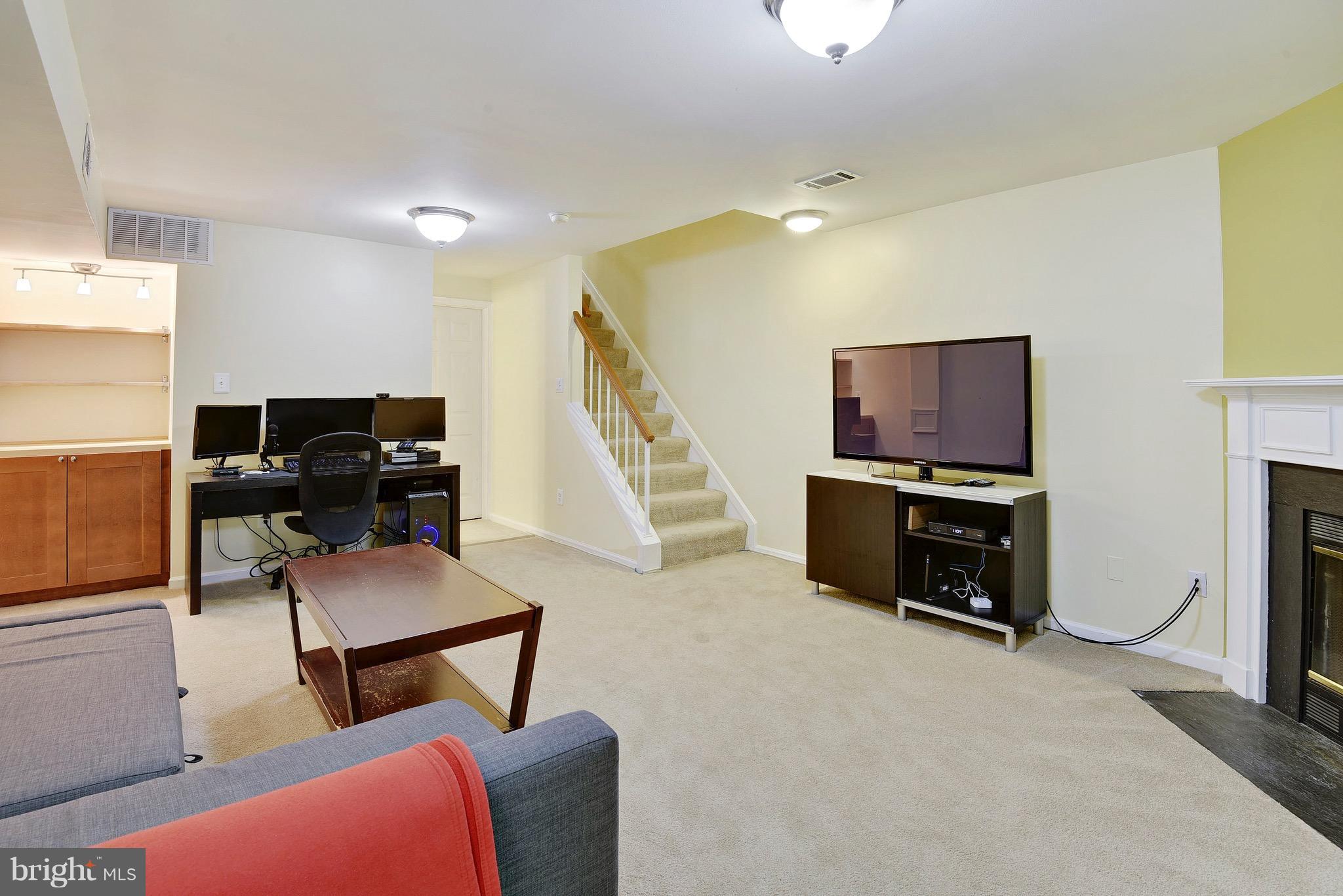 8448 Springfield Oaks Drive Springfield, VA 22153 - Photo 22 of 28 Newer carpet (2015) and built in shelving