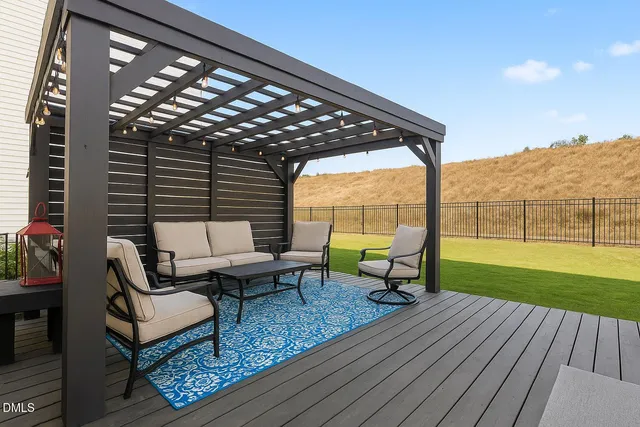 a house view with a sitting space and garden