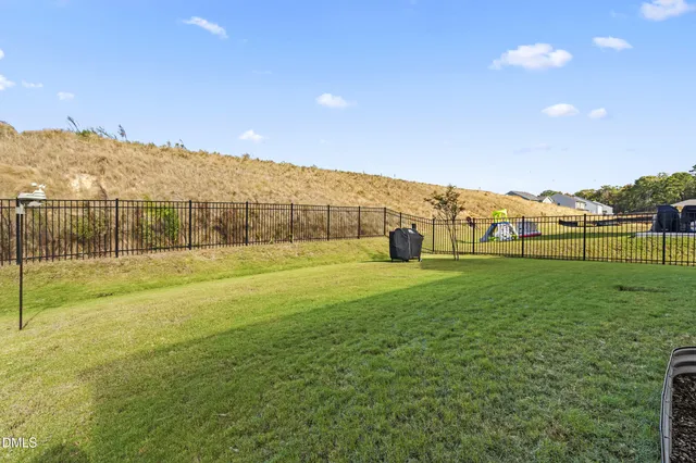 a view of house with wooden floor and outdoor seating