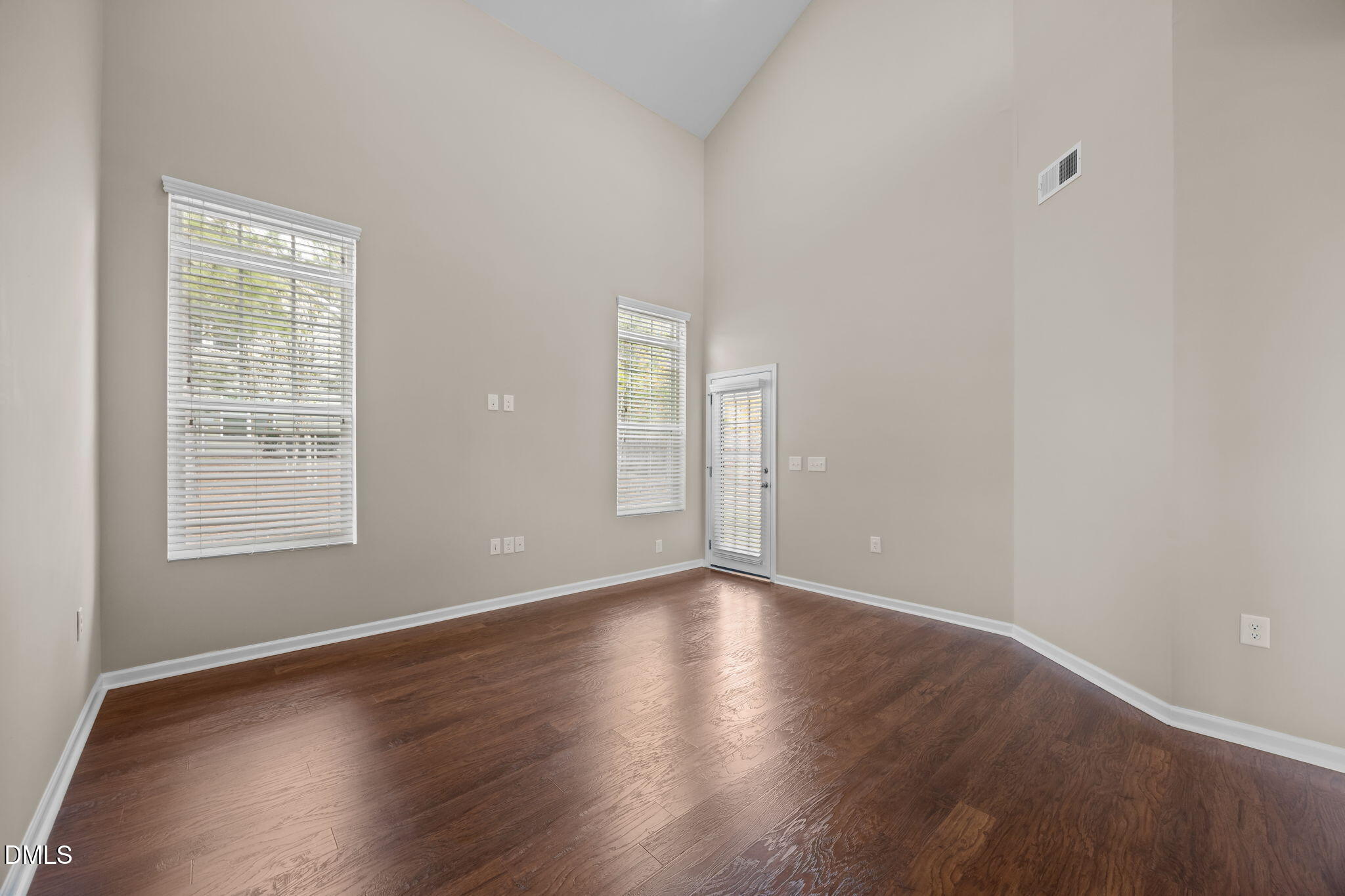 1001 Epiphany Road Morrisville, NC 27560 - Photo 11 of 39 an empty room with wooden floor and windows