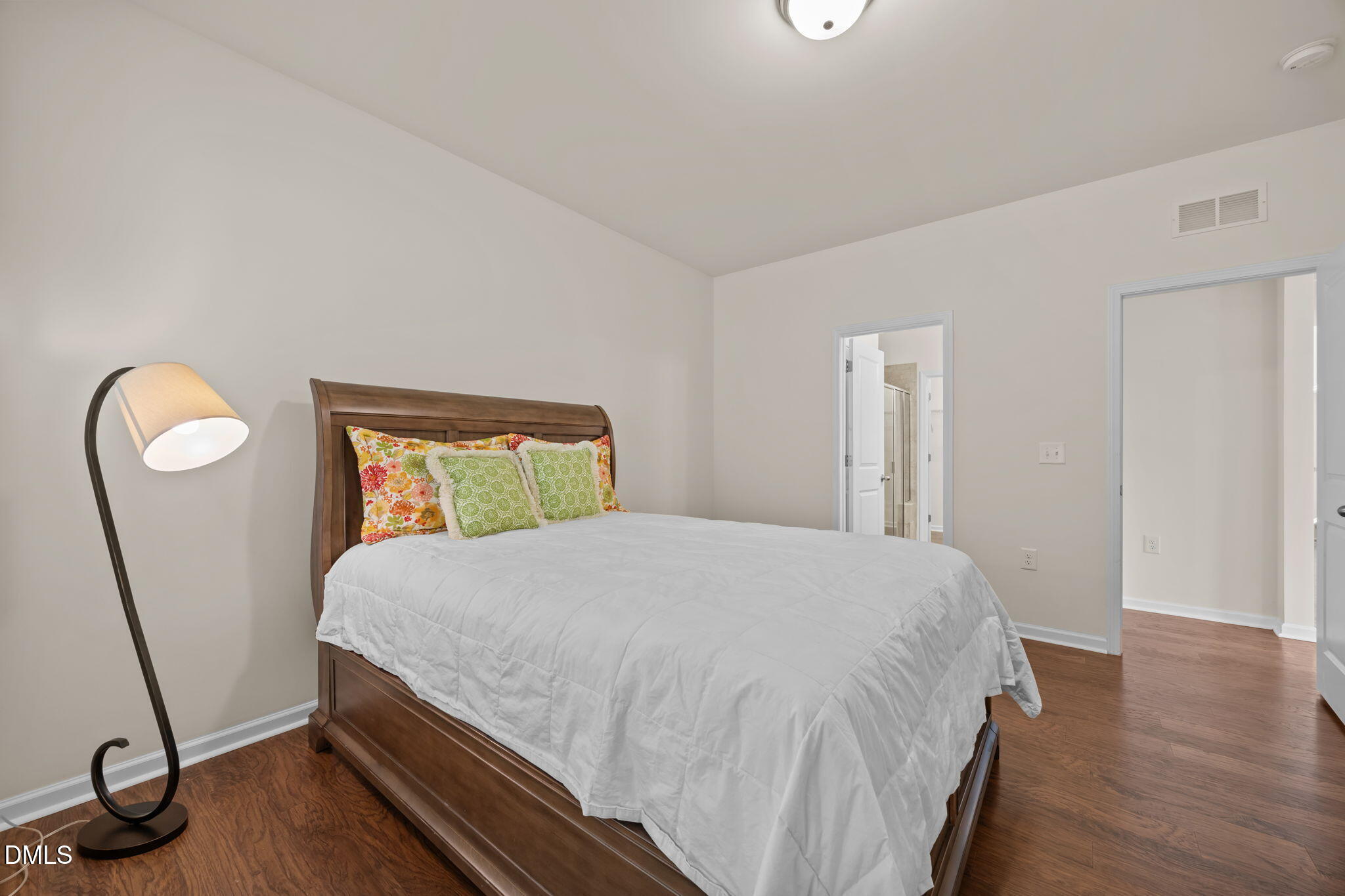 1001 Epiphany Road Morrisville, NC 27560 - Photo 13 of 39 a bedroom with a bed window and wooden floor