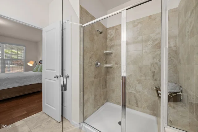 a bathroom with a shower and a sink