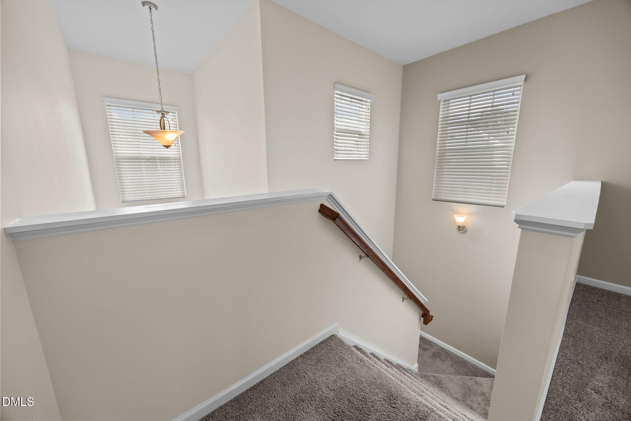 1001 Epiphany Road Morrisville, NC 27560 - Photo 17 of 39 a view of hallway with stairs and wooden floor