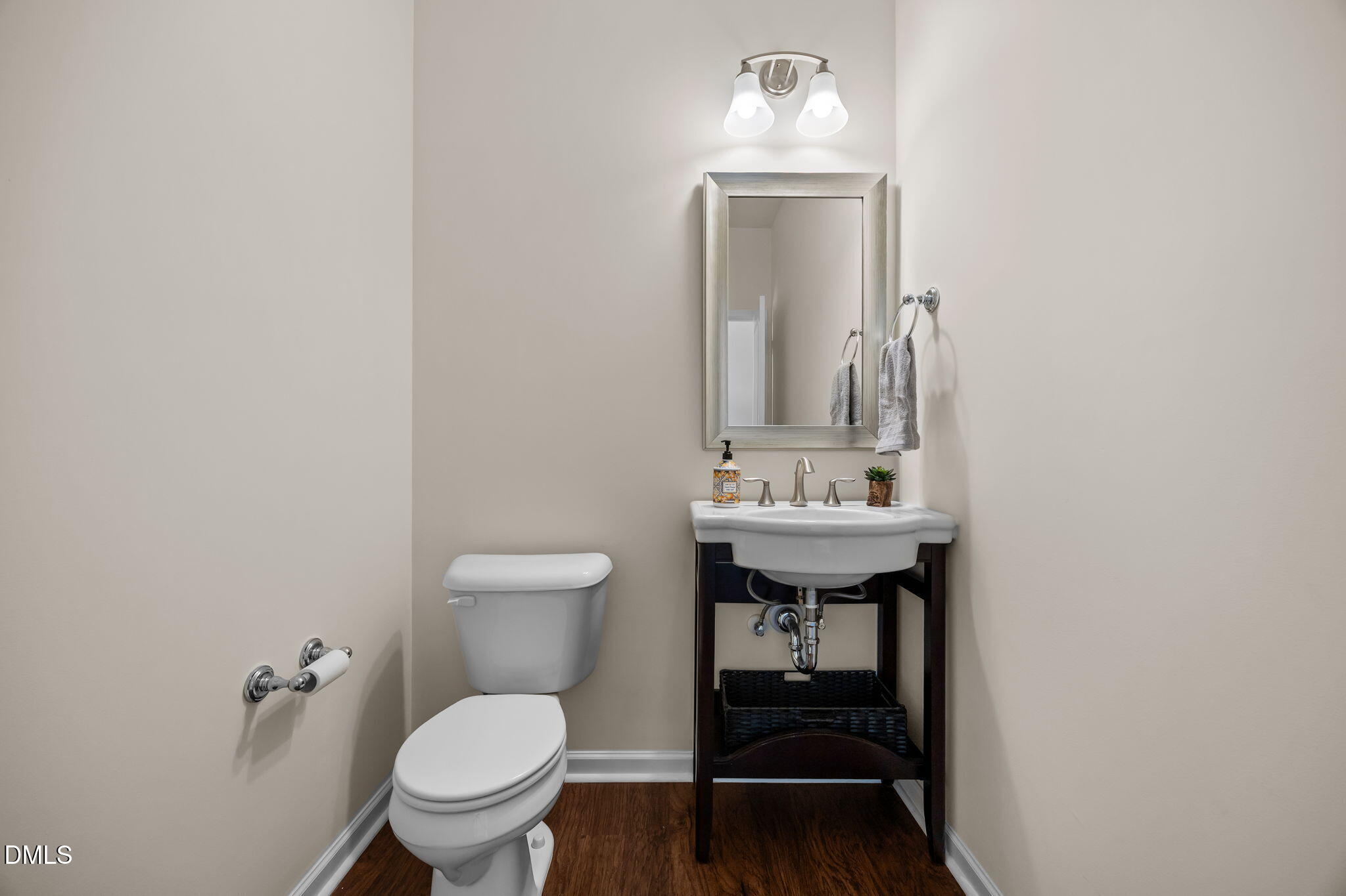 1001 Epiphany Road Morrisville, NC 27560 - Photo 27 of 39 a bathroom with a sink a toilet and mirror