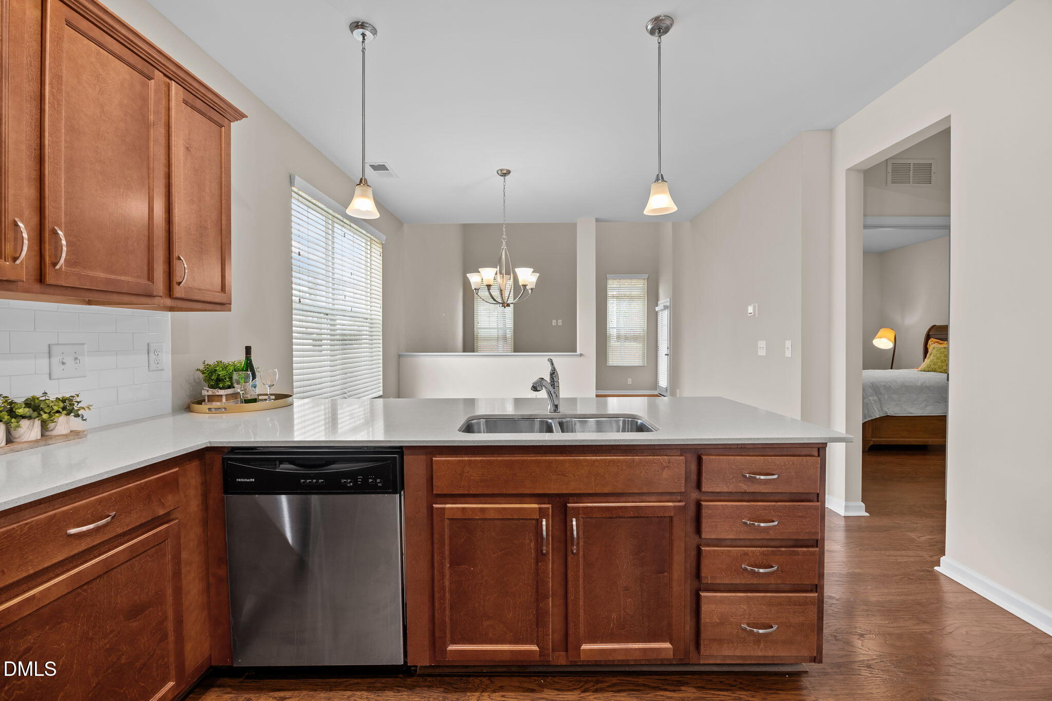1001 Epiphany Road Morrisville, NC 27560 - Photo 4 of 39 a kitchen with a sink a cabinets and wooden floor