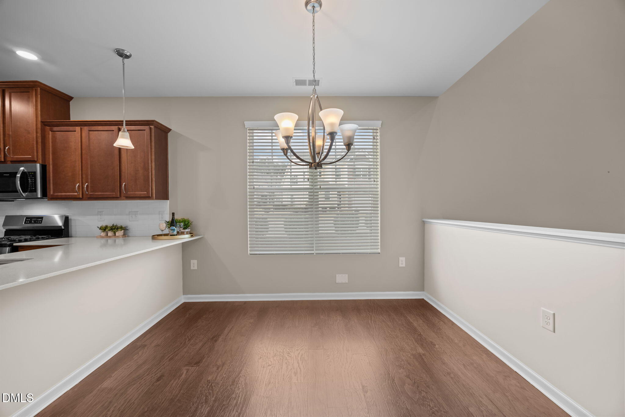 1001 Epiphany Road Morrisville, NC 27560 - Photo 7 of 39 a kitchen with granite countertop a stove and a sink