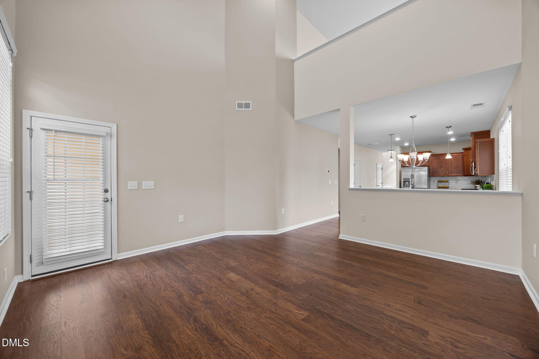1001 Epiphany Road Morrisville, NC 27560 - Photo 10 of 39 an empty room with wooden floor and windows