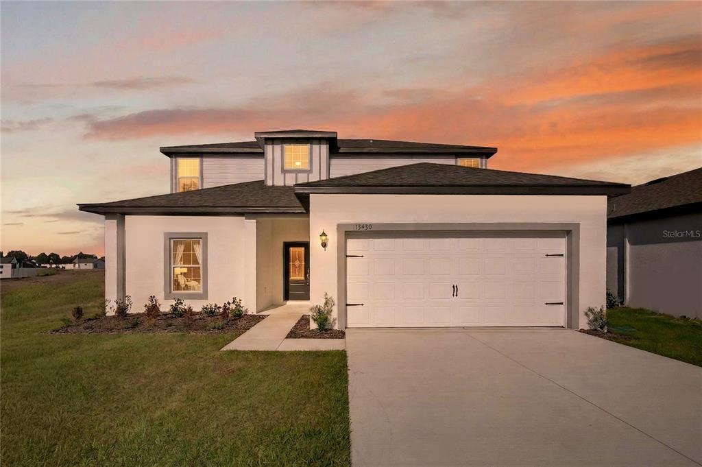 13430 Leaping Water Way Astatula, FL 34705 - Photo 2 of 55 front view of house with a yard