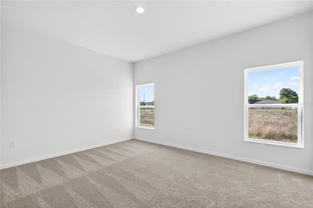 13430 Leaping Water Way Astatula, FL 34705 - Photo 21 of 55 a view of an empty room with a window