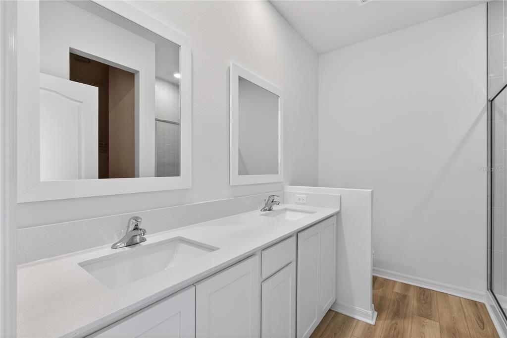 13430 Leaping Water Way Astatula, FL 34705 - Photo 23 of 55 a bathroom with a sink and a mirror