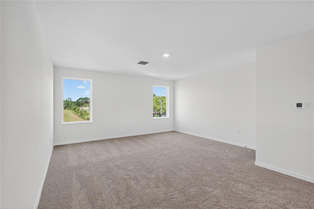 13430 Leaping Water Way Astatula, FL 34705 - Photo 28 of 55 an empty room with windows