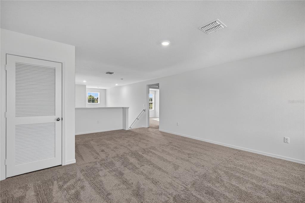 13430 Leaping Water Way Astatula, FL 34705 - Photo 29 of 55 a view of empty room with wooden floor