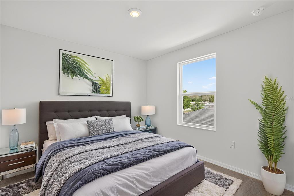 13430 Leaping Water Way Astatula, FL 34705 - Photo 30 of 55 a bedroom with bed and a potted plant