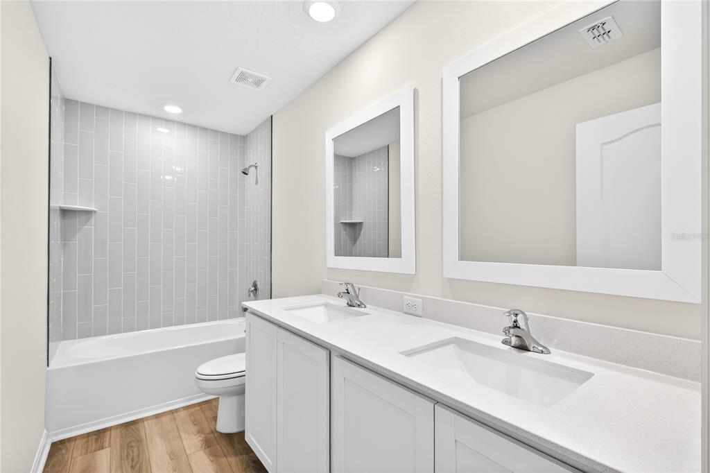 13430 Leaping Water Way Astatula, FL 34705 - Photo 35 of 55 a bathroom with a sink a toilet and shower