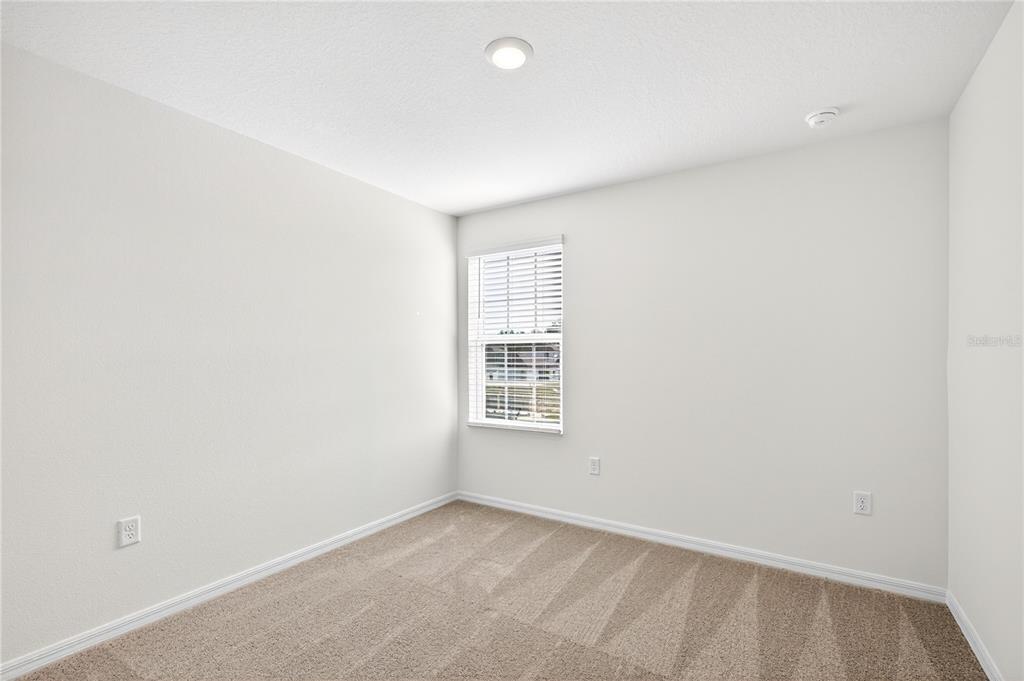 13430 Leaping Water Way Astatula, FL 34705 - Photo 36 of 55 a view of an empty room with a window