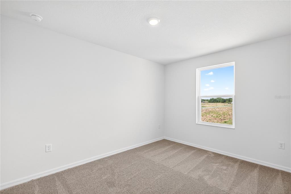13430 Leaping Water Way Astatula, FL 34705 - Photo 38 of 55 an empty room with a window